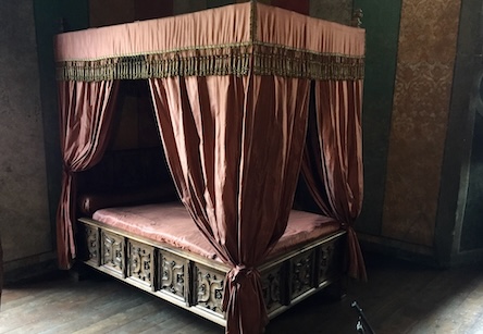 Combustible materials exposed on two sides are subject to a higher risk of ignition, as in the case of this bed where the wooden structure could be immediately involved in a combustion started by the curtains above. (Fireriskheritage.net)